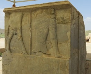 At the ruins of the Palace of Cyrus the Great, depiction of a man with bull's legs and man with one leg as a tail of a fish.